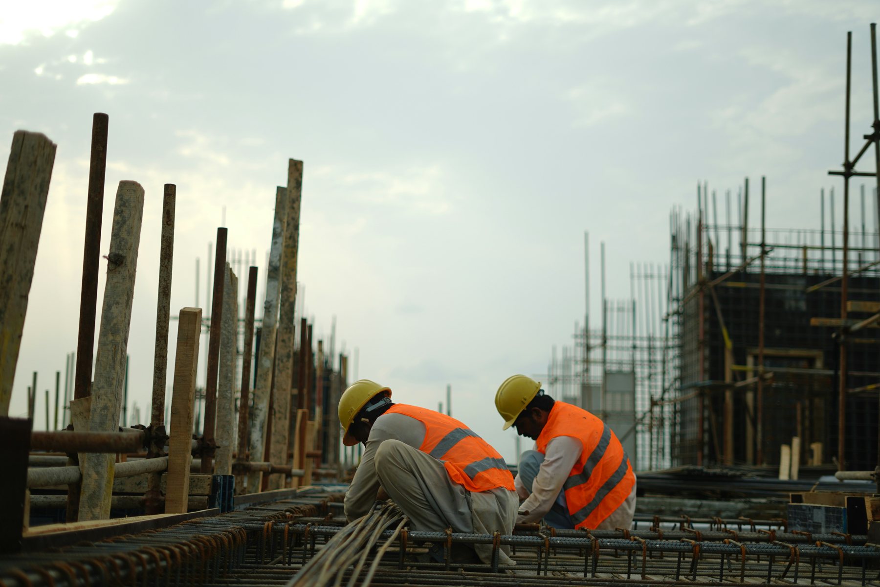 Construction specialists working on a reinforced-concrete construction site